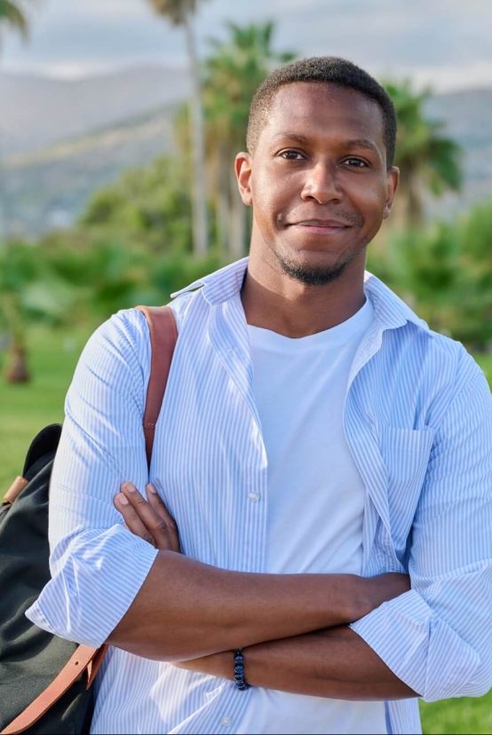 outdoor-portrait-of-african-american-man-with-cros-2022-03-29-23-50-50-utc-e1658645891809.jpg